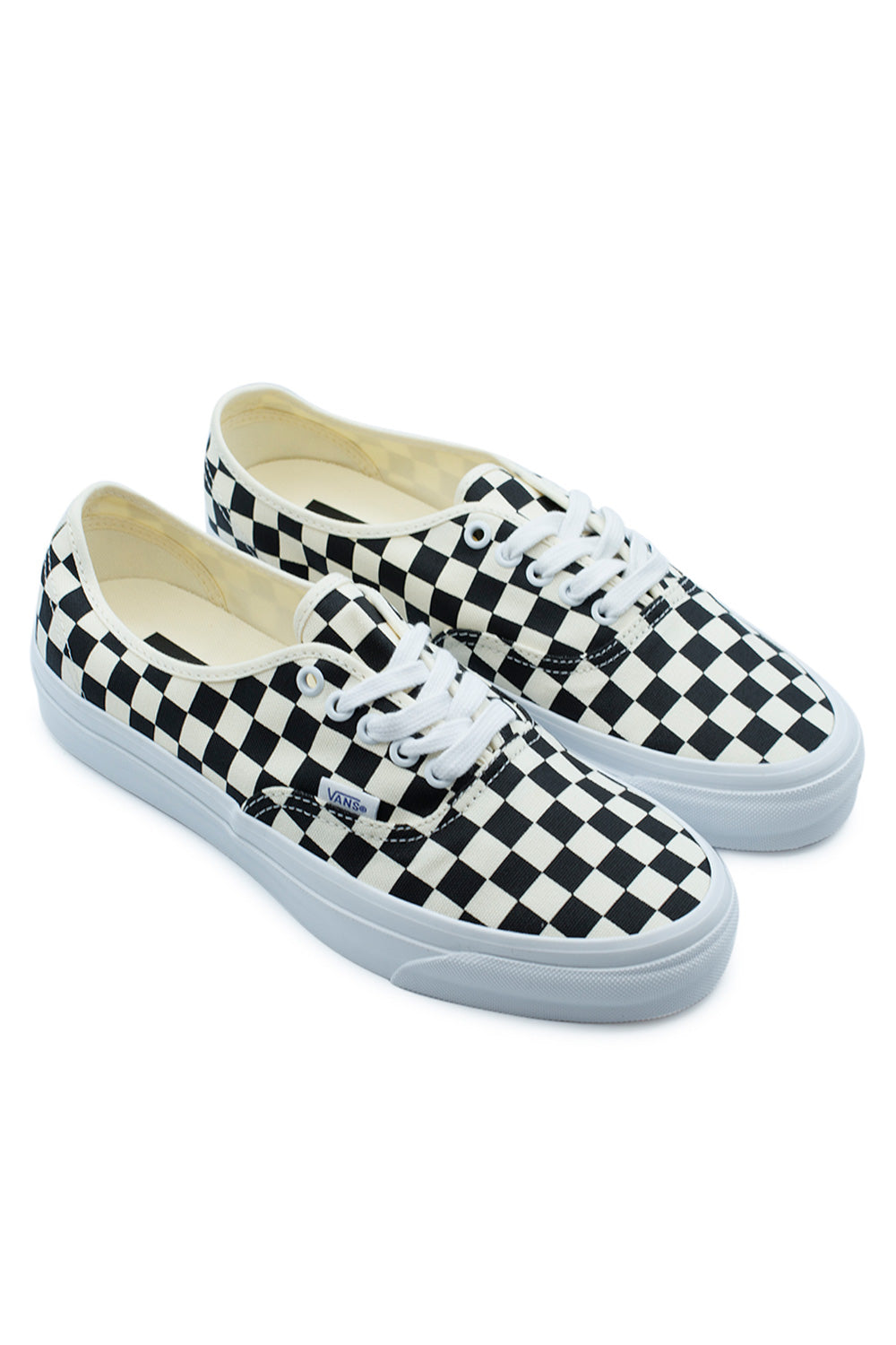Angled view of the Vans LX Authentic Reissue 44 Checkerboard Black / Off White sneakers combining the iconic checkerboard print, durable heavyweight canvas upper, premium vintage foxing, heritage low-top profile and timeless California skate culture styling.