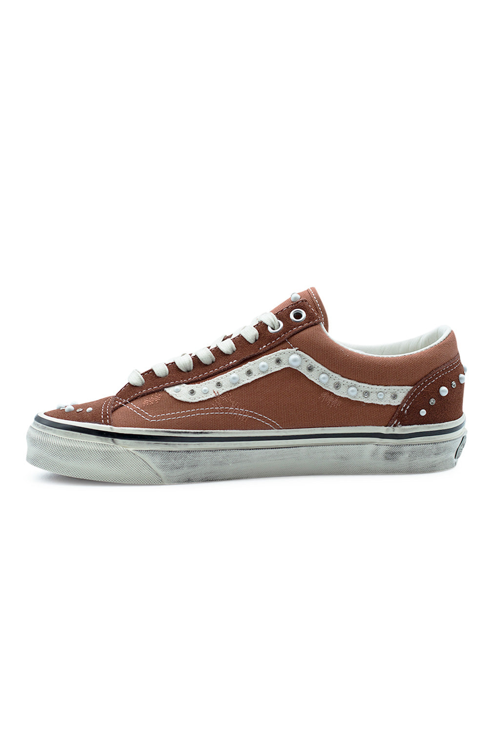 inner side Vans LX Old Skool 36 bronze colorway highlighting reinforced stitching, canvas side panels, pearlized stripe detailing and high-end skate shoe construction