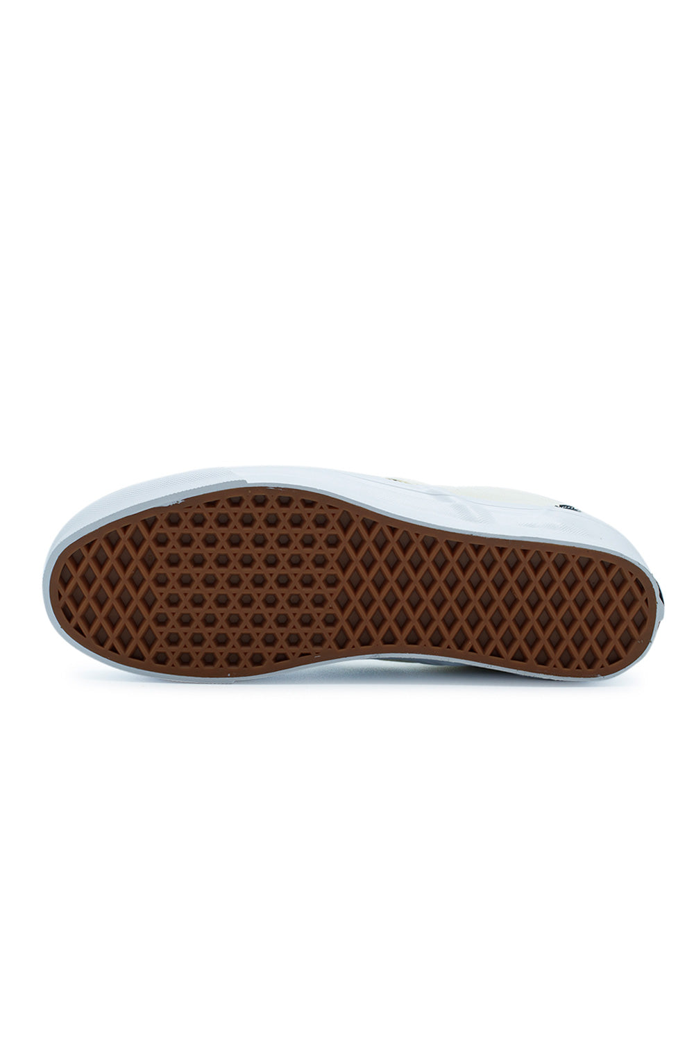 Full view of the classic brown gum rubber waffle outsole of the Vans LX Slip-On Reissue 98 sneaker, showcasing the signature traction pattern.