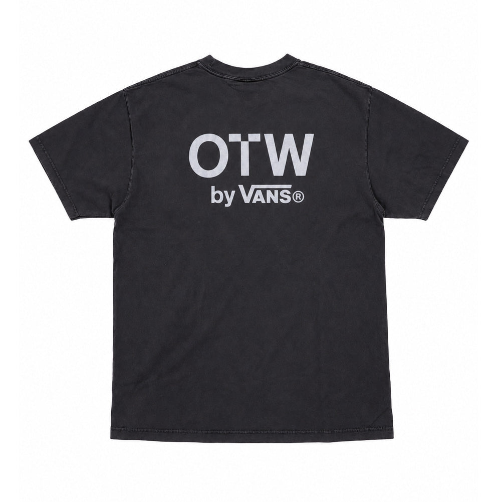 Back flat lay studio perspective of the washed black Vans OTW x Chito T-Shirt, highlighting the clean, boxy drape of the cotton jersey, dropped shoulder seams, and an oversized bright white screen print of the bold block logo reading "OTW by VANS" across the upper back.