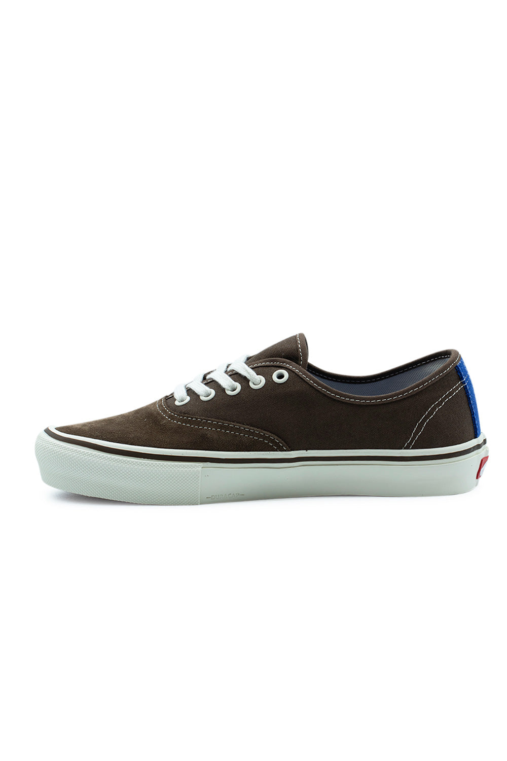 Medial side view of the Vans Skate Authentic shoe in Vintage Cocoa, detailing the dark brown canvas midfoot panel, white contrast stitching along the seams, blue heel strip, and the subtle embossed DuraCap branding on the front off-white midsole.