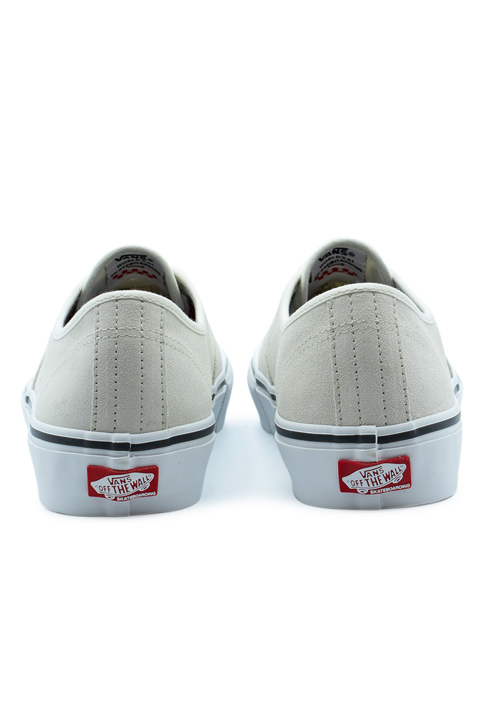 Rear view of the heels of the Vans Skate Authentic White / Gunmetal shoes, displaying the clean off-white suede heel counter with double vertical stitching and the red Vans Off The Wall Skateboarding rubber heel plate on the high foxing tape.