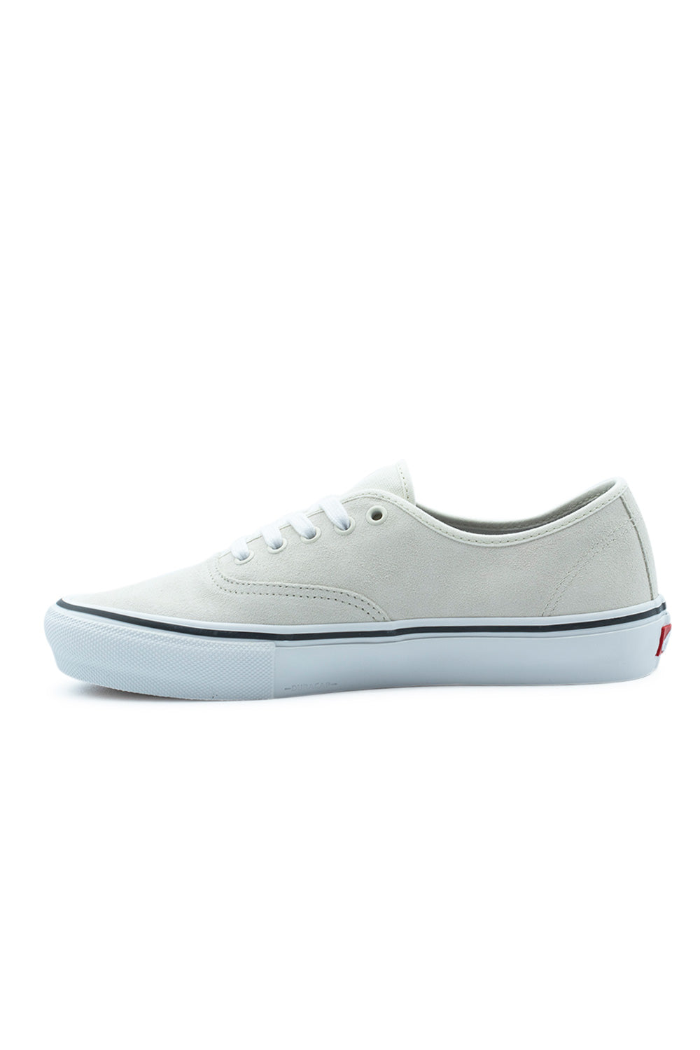 Medial side profile view of the Vans Skate Authentic White / Gunmetal shoe, illustrating the continuous off-white suede midfoot panel, white tonal stitching, gunmetal pinstripe on the foxing, and subtle embossed DuraCap branding on the front midsole.