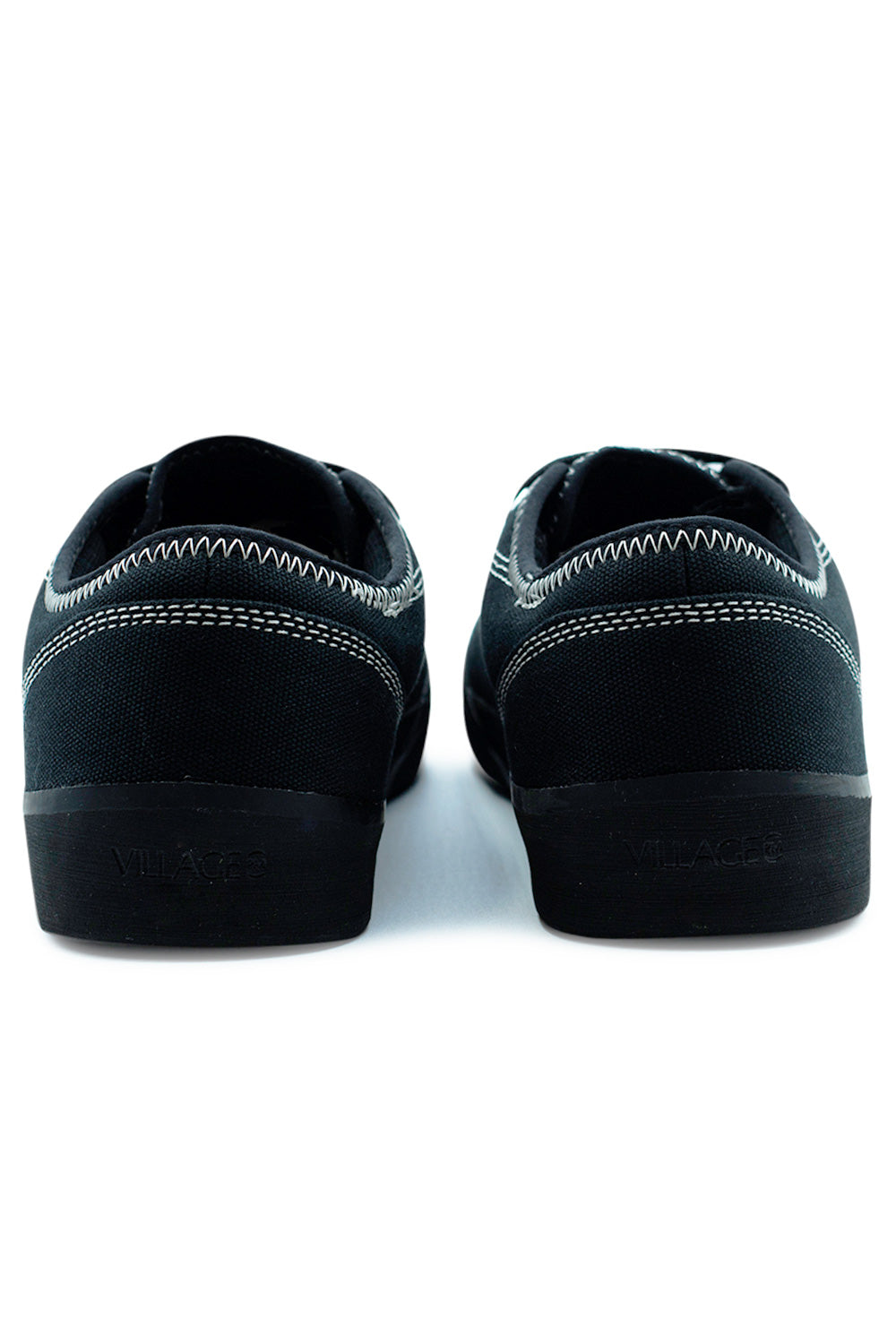 Rear view of Village PM 1.30PM Black Natural Black skate sneaker highlighting reinforced heel panel, contrast stitching and durable rubber midsole with Village PM branding