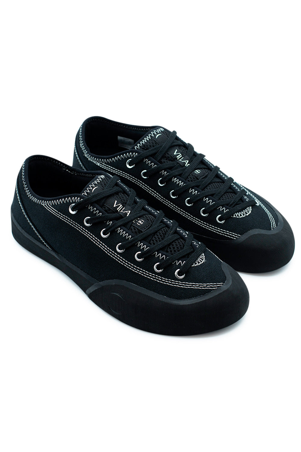 Village PM 1.30PM Black Natural Black skate shoe pair angled view showcasing lightweight canvas construction, wrapped rubber rand and modern performance skate silhouette