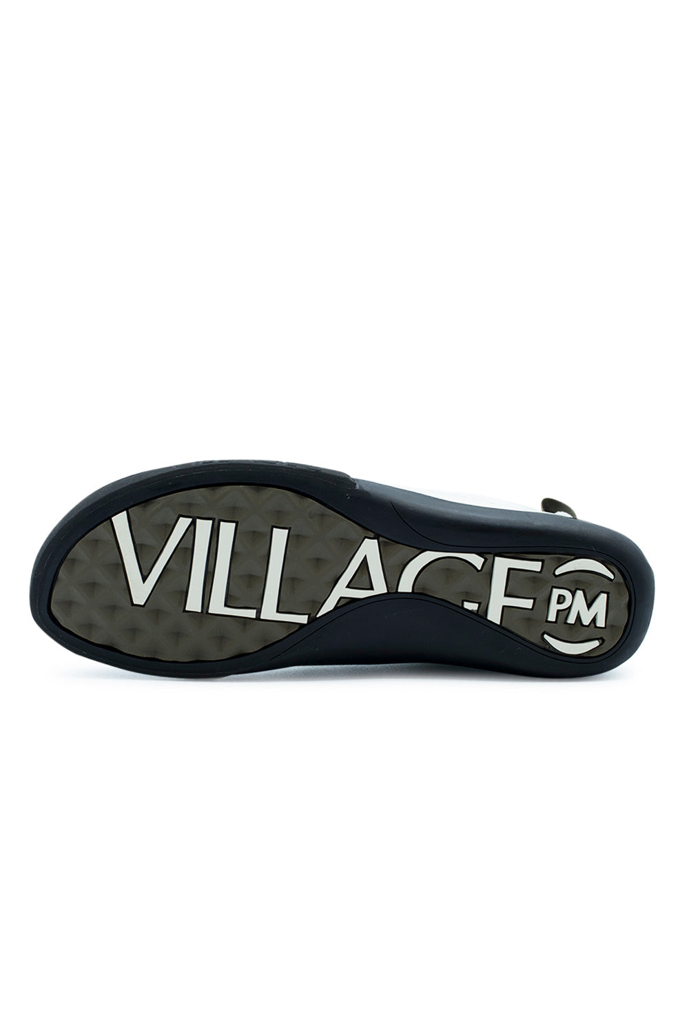Full bottom perspective of the rubber outsole on the Village PM 2PM, featuring olive-grey diamond-lug traction tread stamped with bold, oversized white "VILLAGE PM" brand lettering spanning the midfoot arch and surrounded by the textured black climbing rubber perimeter wrap.