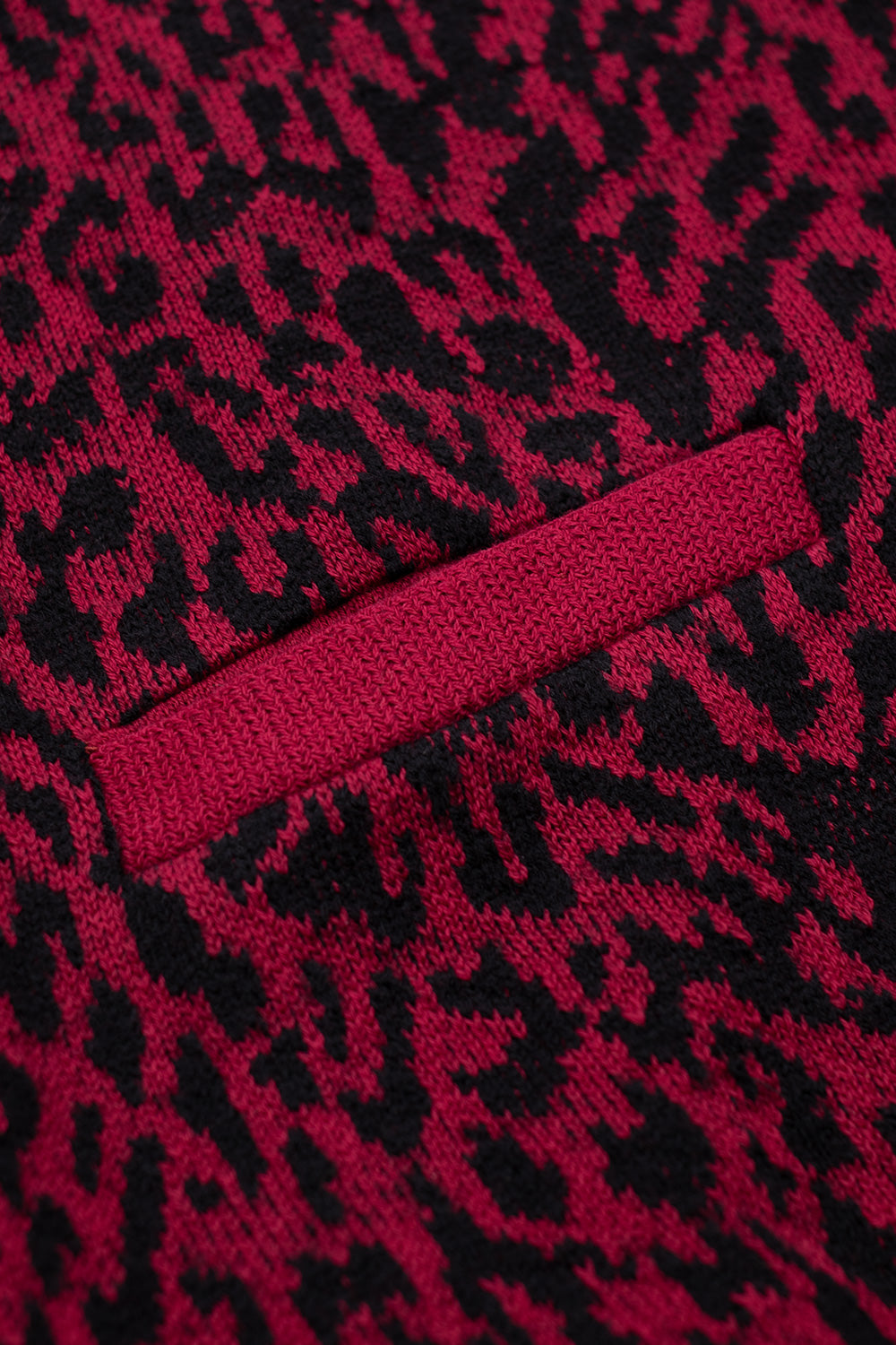 Wacko Maria cardigan front pocket detail with woven leopard pattern, premium Japanese knitwear design with ribbed trims and functional side pockets