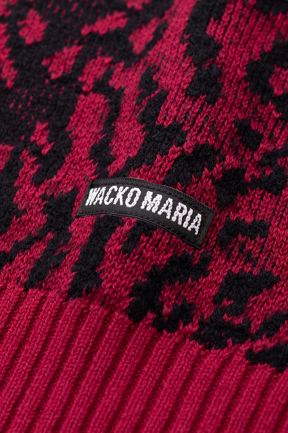Wacko Maria leopard pattern knit sweater in red and black with signature side label, textured jacquard weave, premium 60% cotton 40% wool blend, modern Japanese streetwear design