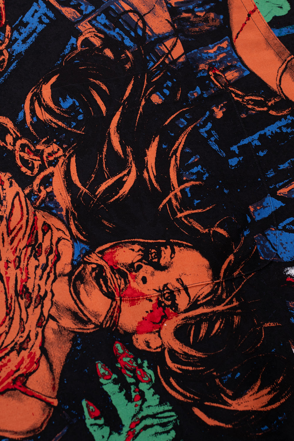 Detailed print of Wacko Maria x Terrifier shirt showcasing intense horror illustration, Art the Clown imagery, vivid multicolor all-over print on lightweight rayon fabric