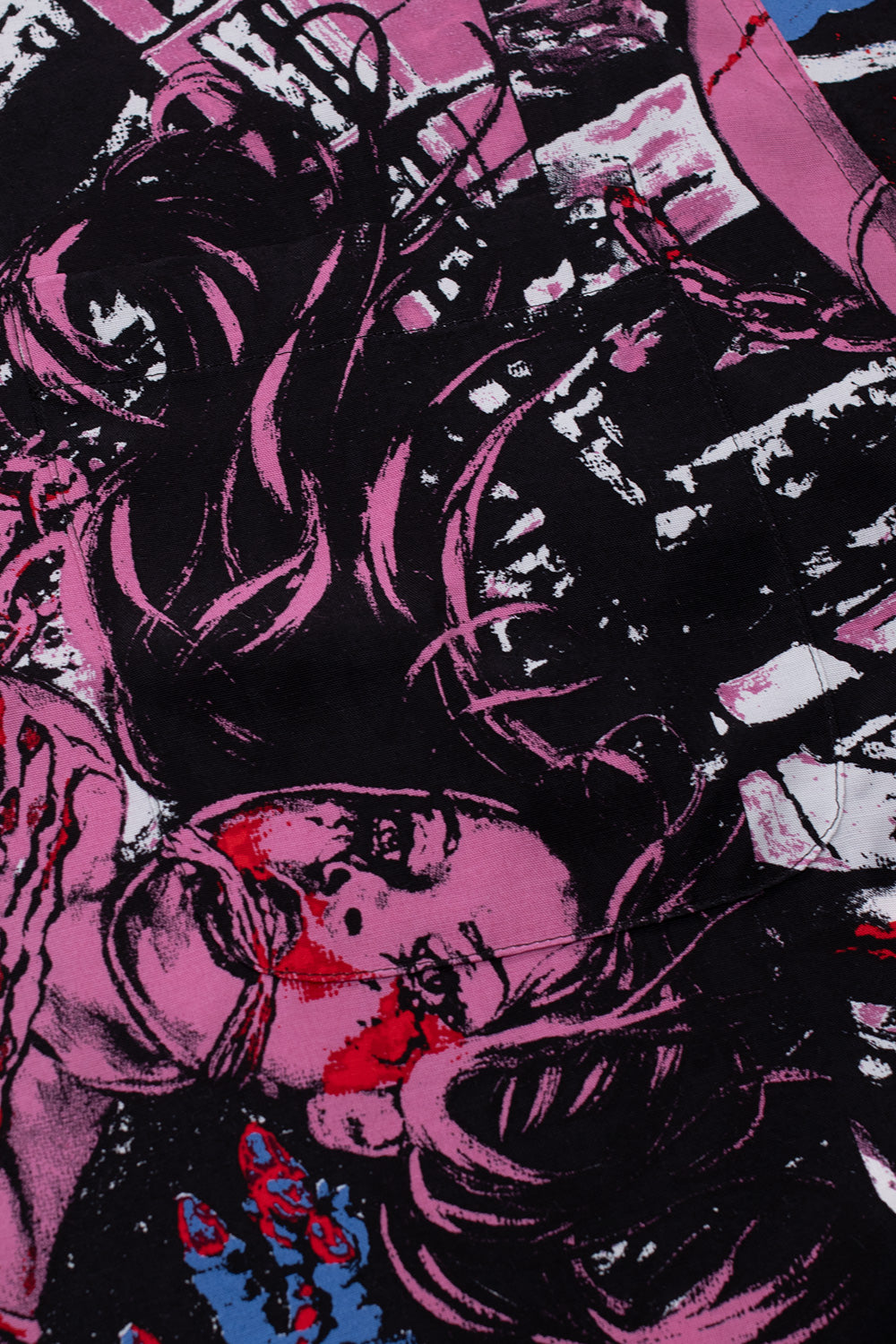 Detailed artwork on Wacko Maria x Terrifier rayon shirt featuring intense horror scene illustration, pink and black tones, cinematic all-over print inspired by Damien Leone film