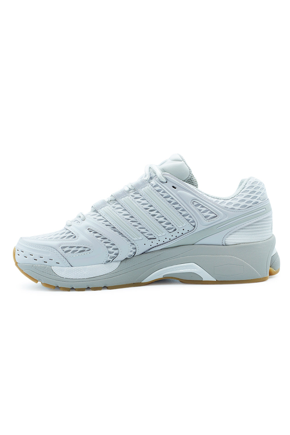 Medial side view of the Adidas Adistar Control 5 running shoe, highlighting the sculpted white EVA foam midsole and protective overlays on the high-wear areas.