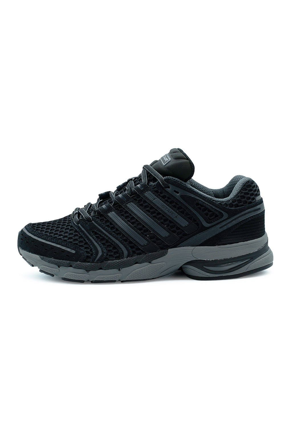 Lateral side profile view of the Adidas Adistar Control 5 sneaker in Core Black and Iron Metallic, featuring an open-pore black mesh base, durable suede and synthetic overlays, segmented nubuck Three Stripes with metallic borders, and a two-tone Grey Six EVA midsole equipped with responsive Adiprene+ cushioning.
