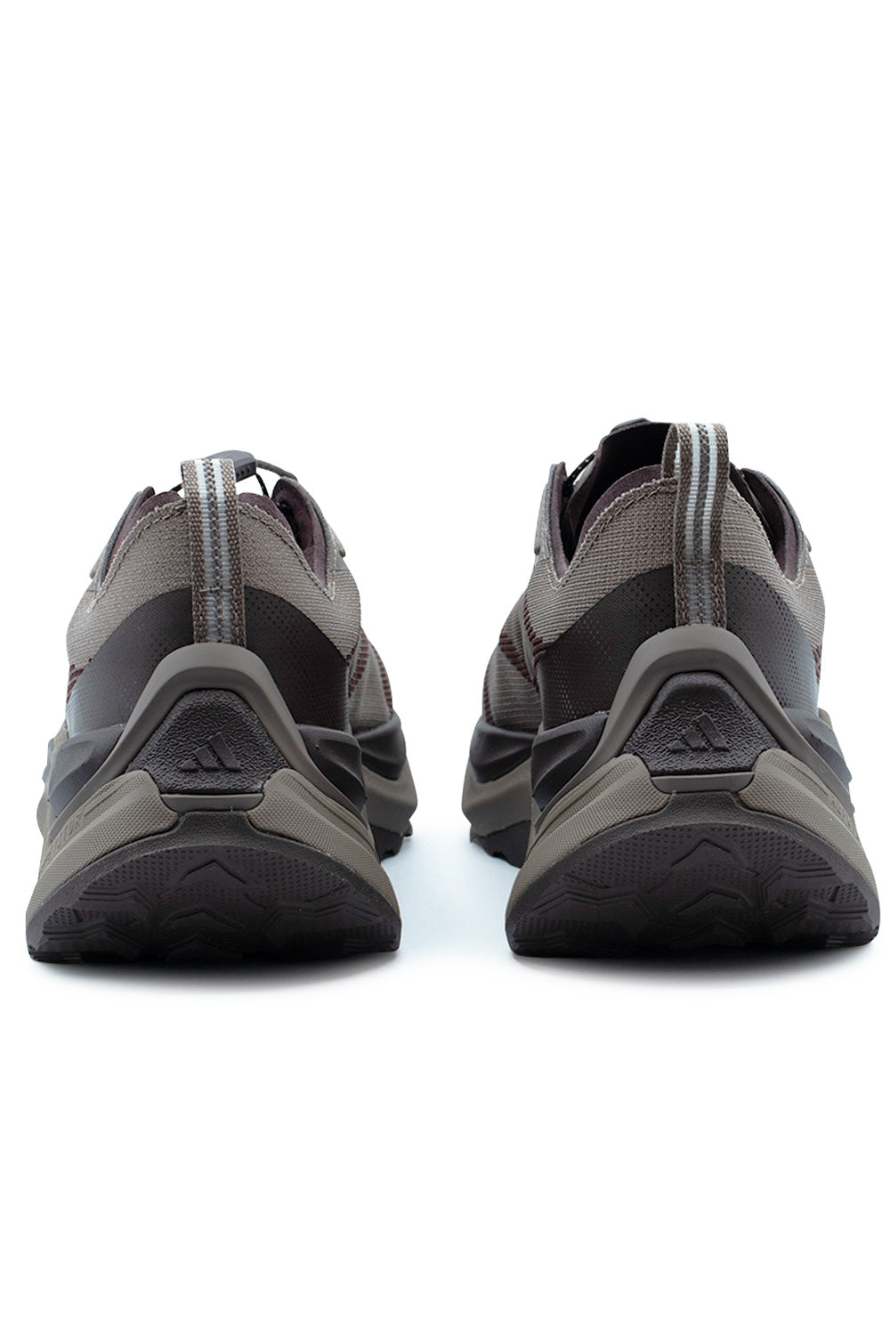 Rear heel view of the Adidas Holo Peak sneakers in Trace Brown and Maroon, displaying the chunky geometric midsole structure, embossed Three Stripes emblem on the textured rubber heel cap, and striped webbing pull tabs.
