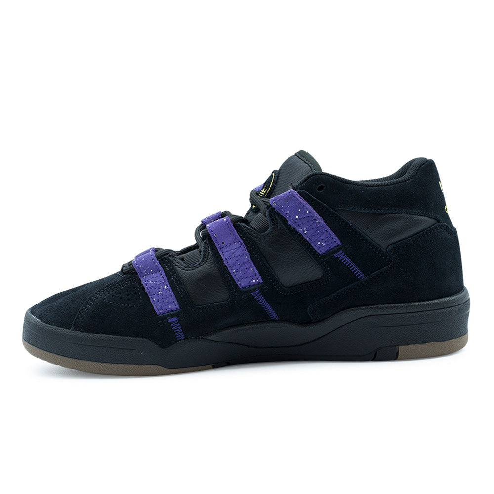 Medial side profile view of the adidas Kader shoe, highlighting the robust arch reinforcement, full-grain black leather medial underlay, three Collegiate Purple hairy suede strap overlays anchored with purple reinforcement stitching, and the sculpted black cupsole chassis.
