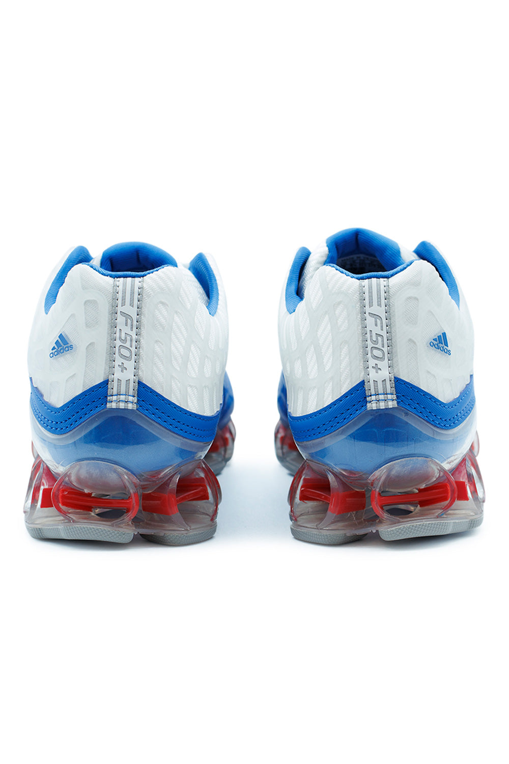Back view of Adidas Megaride F50 shoes showcasing stabilizing heel structure, dual-injected TPU cushioning and bold football heritage design in Blue Bird and Silver Metallic