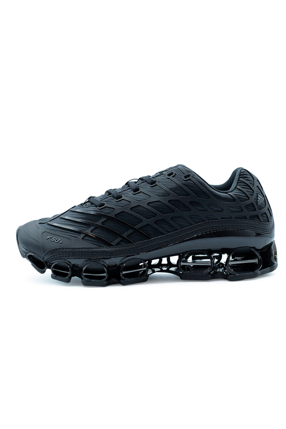 Adidas Megaride F50 Core Black sneaker side view showcasing futuristic F50 structure, black mesh and synthetic upper, Megaride cushioning system, and performance-inspired lifestyle design