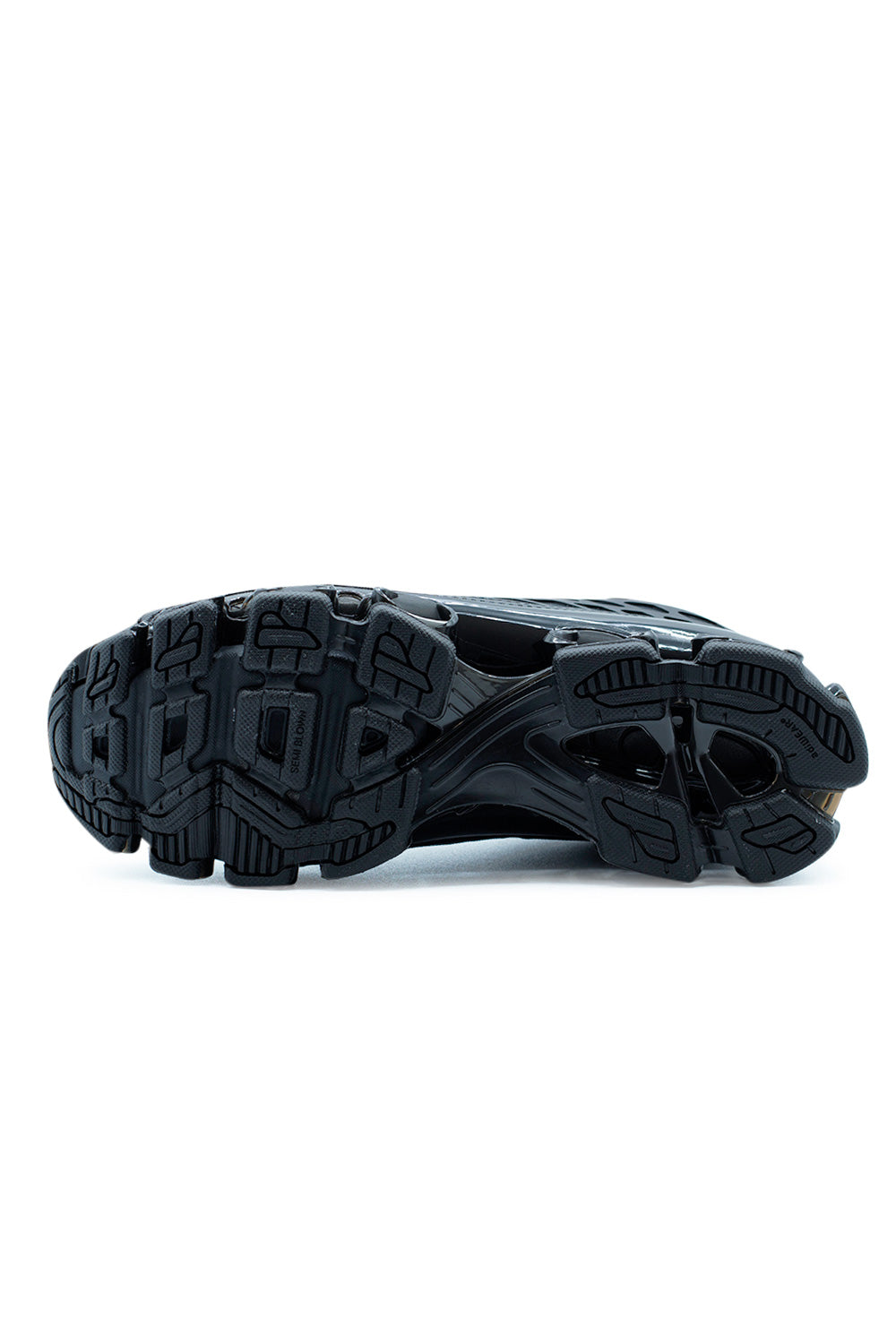 Outsole view of Adidas Megaride F50 Core Black revealing segmented rubber traction pattern, TPU cushioning pods, and cold cement construction for everyday comfort