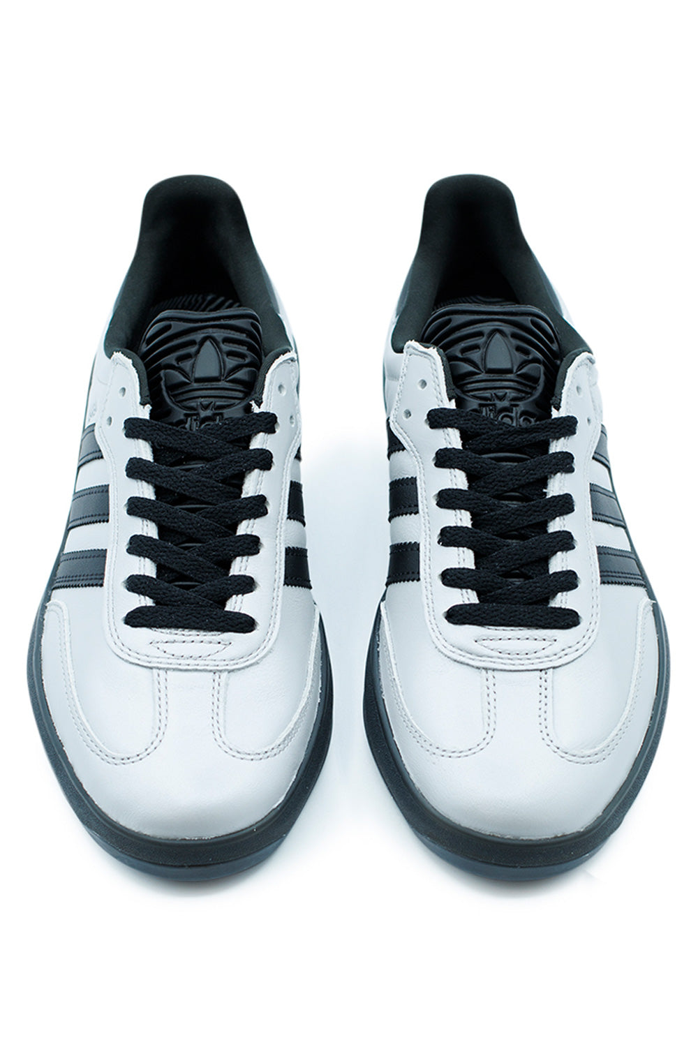 Top front view of Adidas Puig Samba skateboarding sneakers in Silver Metallic and Core Black with black laces, padded tongue, textile lining and classic Samba inspired silhouette