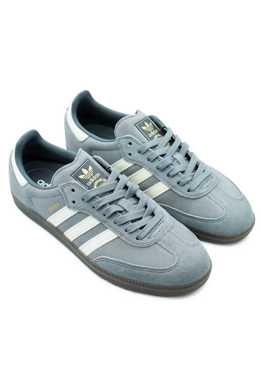 Adidas Samba ADV Grey Four skate shoes in angled pair view highlighting suede material, leather stripes, and durable cupsole grip.