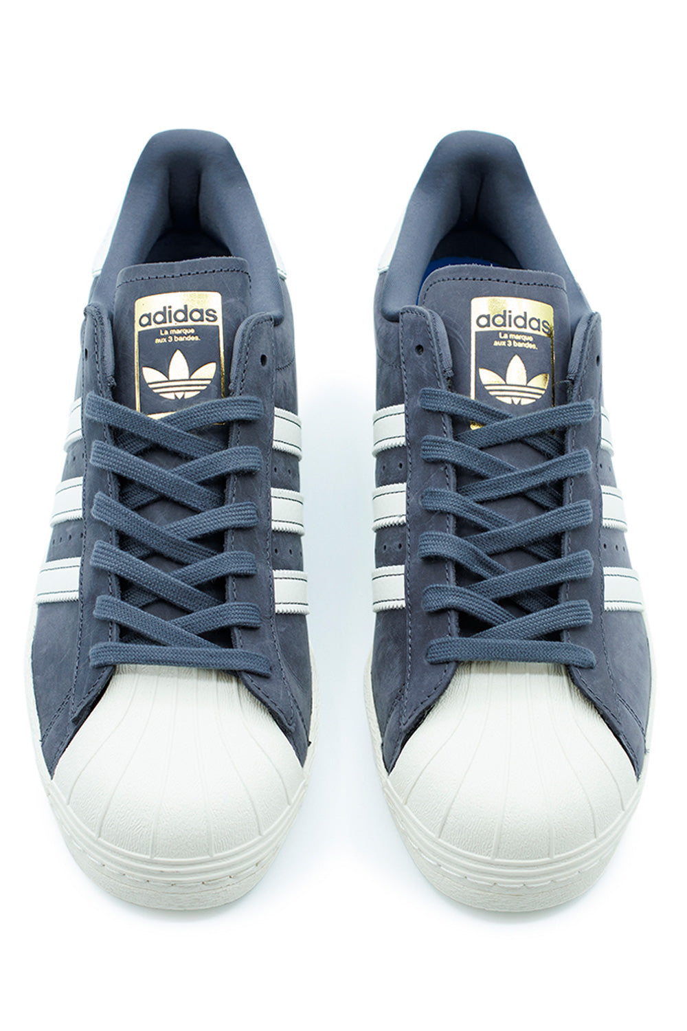 Top view of Adidas Superstar 80 ADV skateboarding sneakers in Aurora Onix and Chalk White with premium leather and lace closure