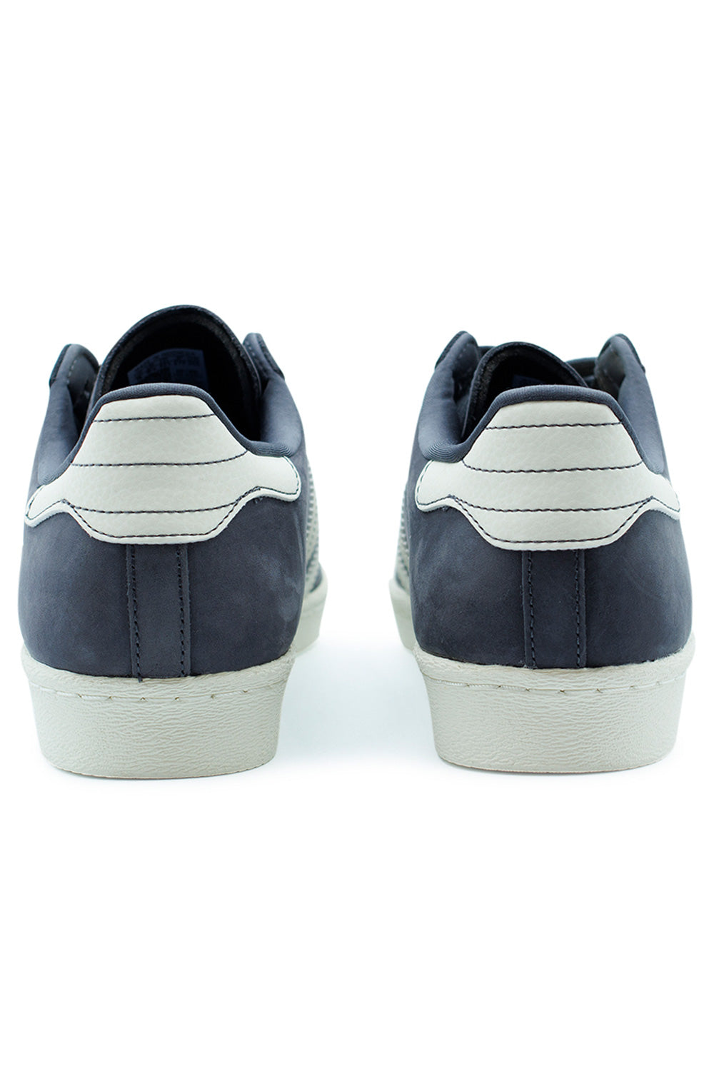 Rear heel detail of Adidas Superstar 80 ADV showing Off White rubber cupsole and vintage Superstar skate silhouette