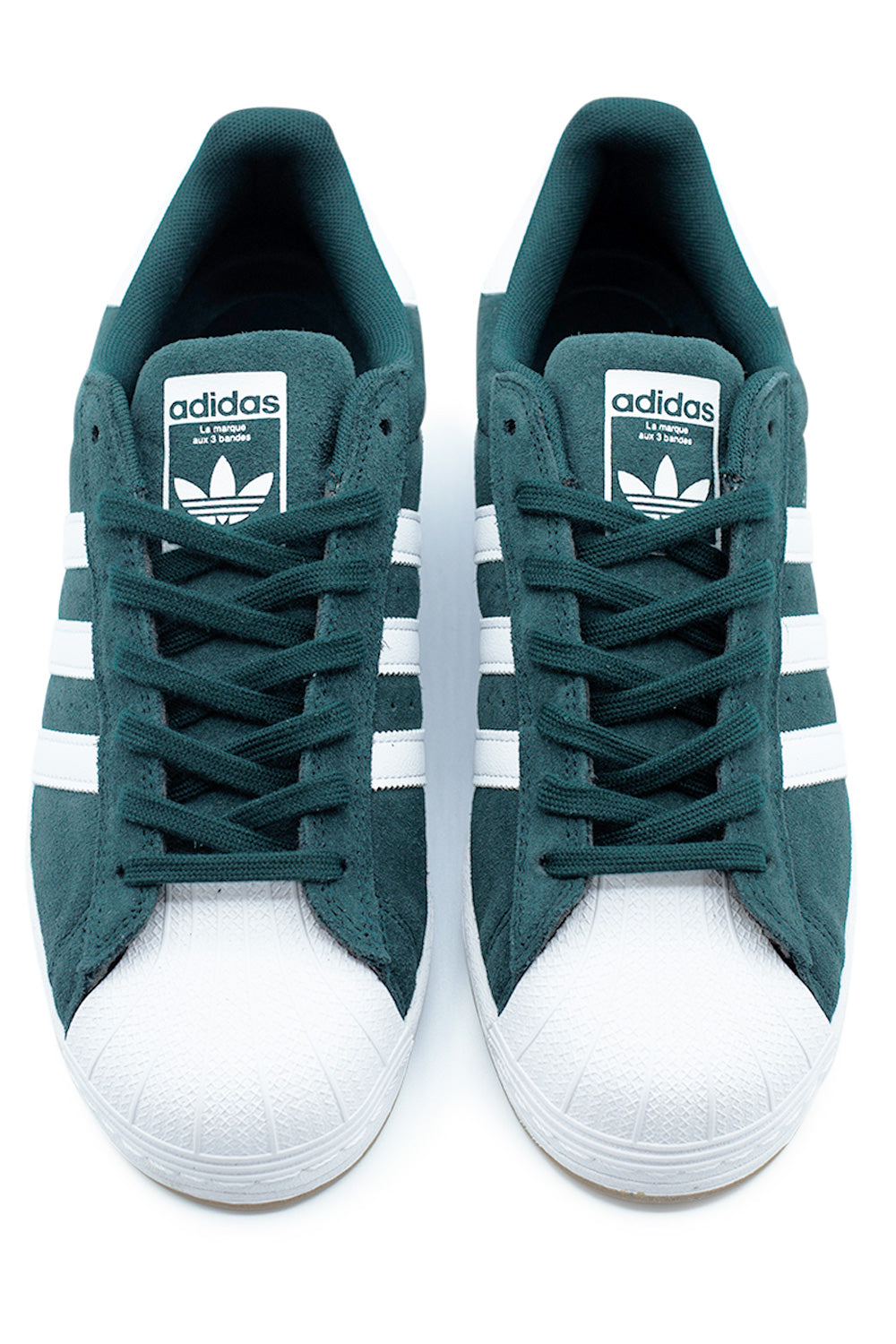 Top view of Adidas Superstar ADV Aurora Ivy Cloud White Gold Metallic skate shoe featuring padded tongue with Trefoil branding, classic shell toe protection and premium suede upper with flat skate laces