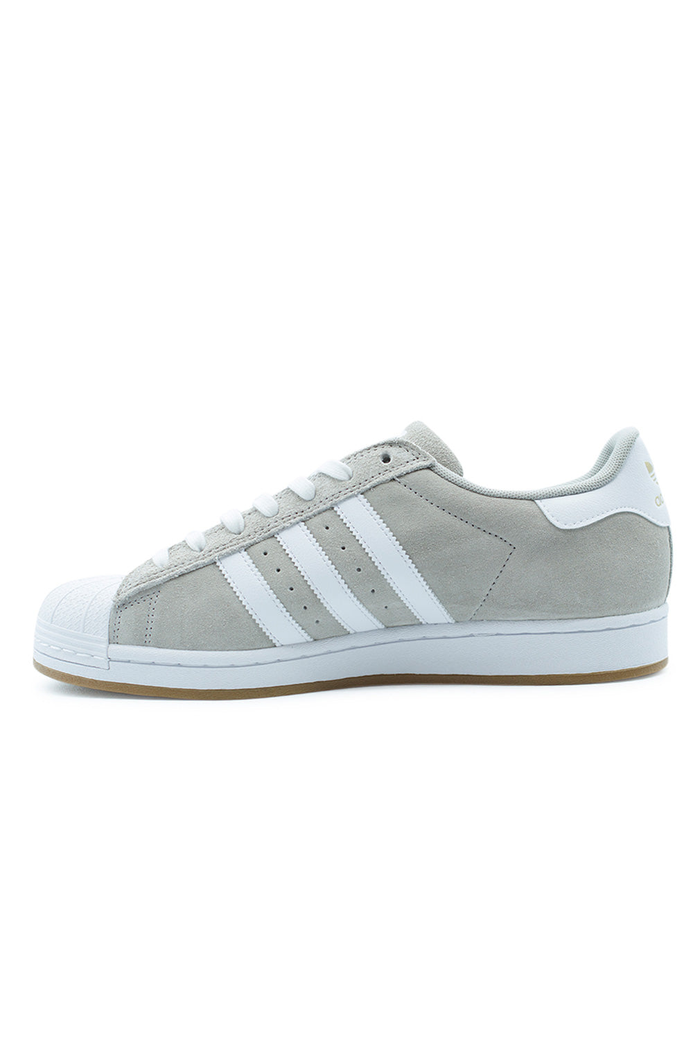 Side view of adidas Superstar ADV skateboarding sneakers in Clear Granite and Cloud White featuring gold metallic branding, premium suede construction, reinforced ADITUFF toe and classic shell toe design.