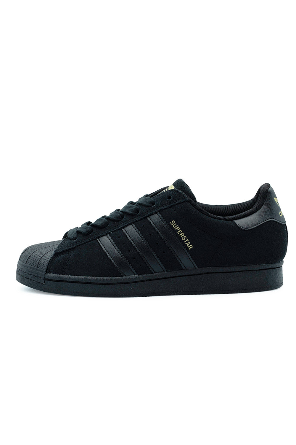 Lateral side profile view of the all-black Adidas Skateboarding Superstar ADV shoe, featuring a premium black suede upper, tonal leather 3-Stripes, metallic gold foil Superstar lettering, a textured black rubber shell toe cap, and a matching stitched cupsole.