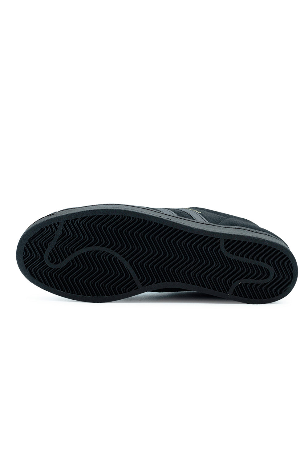 Full bottom view of the solid black rubber outsole on the Adidas Superstar ADV skate shoe, displaying the classic multi-directional herringbone tread pattern engineered for flexible board grip and flick control.