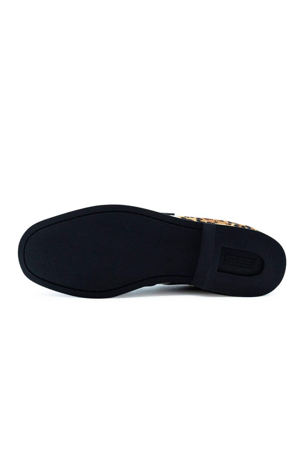 Bottom view of the flat black rubber outsole on the Adidas X Brain Dead Bowling shoe, featuring perimeter sole stitching around the forefoot and a raised square bowling heel with an integrated rectangular Adidas Trefoil logo badge.
