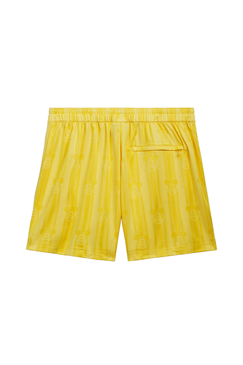 Back view of the adidas x Brain Dead x Disney Football Short Bold Gold featuring all over Mickey Mouse jacquard pattern, elastic waistband with drawstring, zip back pocket, lightweight polyester construction and limited adidas x Brain Dead x Disney World Cup capsule collection