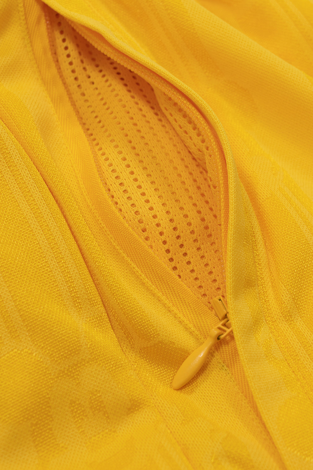 Close-up of the zip side pocket with breathable mesh lining on the adidas x Brain Dead x Disney Football Short Bold Gold highlighting premium functionality, lightweight polyester fabric and retro football performance design