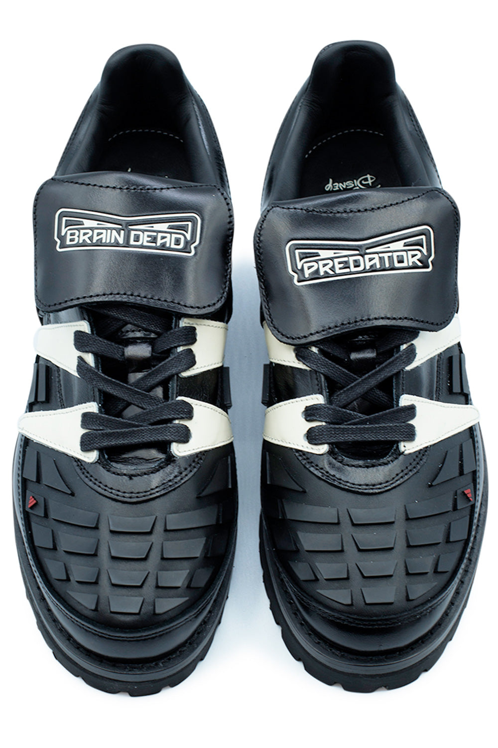 Top view of the Adidas x Brain Dead x Disney Predator KJ4289 showcasing interchangeable Brain Dead and Predator tongue flaps, waxed laces, molded rubber forefoot elements, premium leather upper and classic 90s football aesthetics reworked into luxury streetwear footwear.