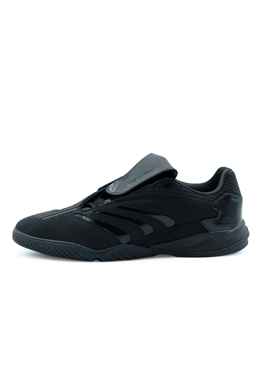 Lateral side profile view of the blackout Adidas Skateboarding X Metalwood Studio Predator Sala shoe, featuring a premium oiled nubuck upper, glossy patent leather 3-Stripes, an oversized fold-over tongue, external heel counter, and a low-profile black rubber indoor sala midsole.