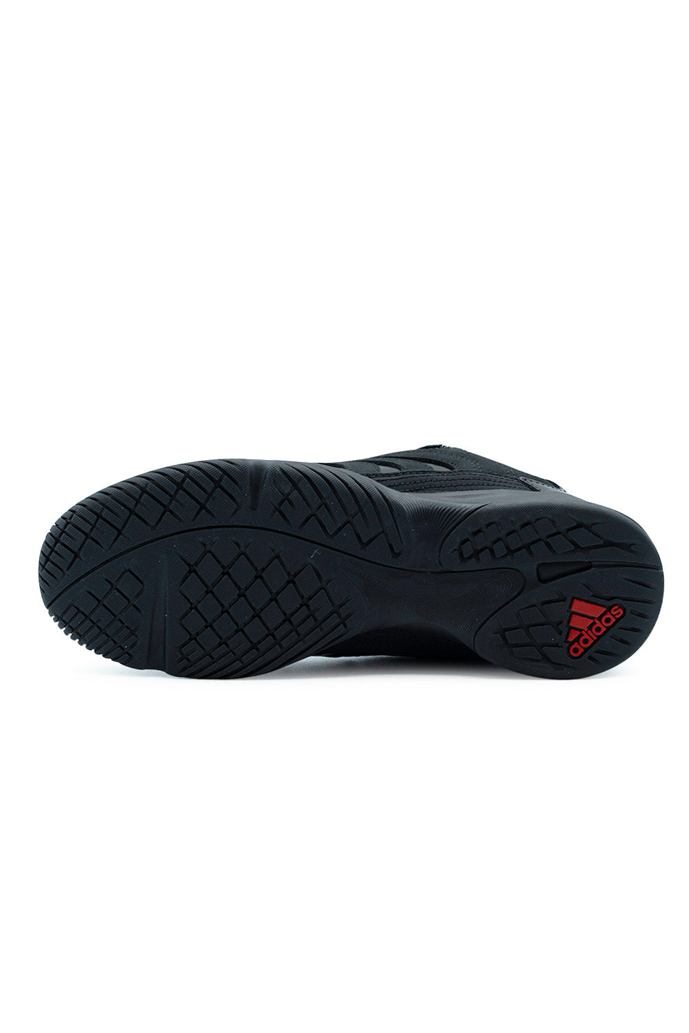 Full bottom view of the black rubber indoor sala outsole on the Adidas X Metalwood Studio Predator Sala shoe, showing the multi-directional traction herringbone tread with a vibrant red embossed Adidas performance logo on the heel.