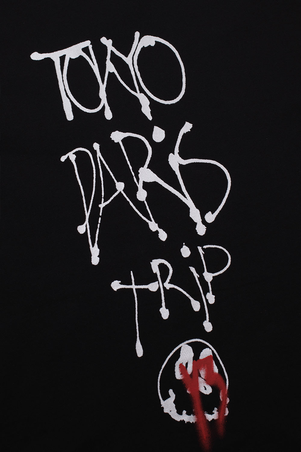 Detailed shot of the front chest graphic on the black Adidas Y-3 X Chito City Graphic Tee, displaying artist Chito's spray paint calligraphy typography with ink drip effects.