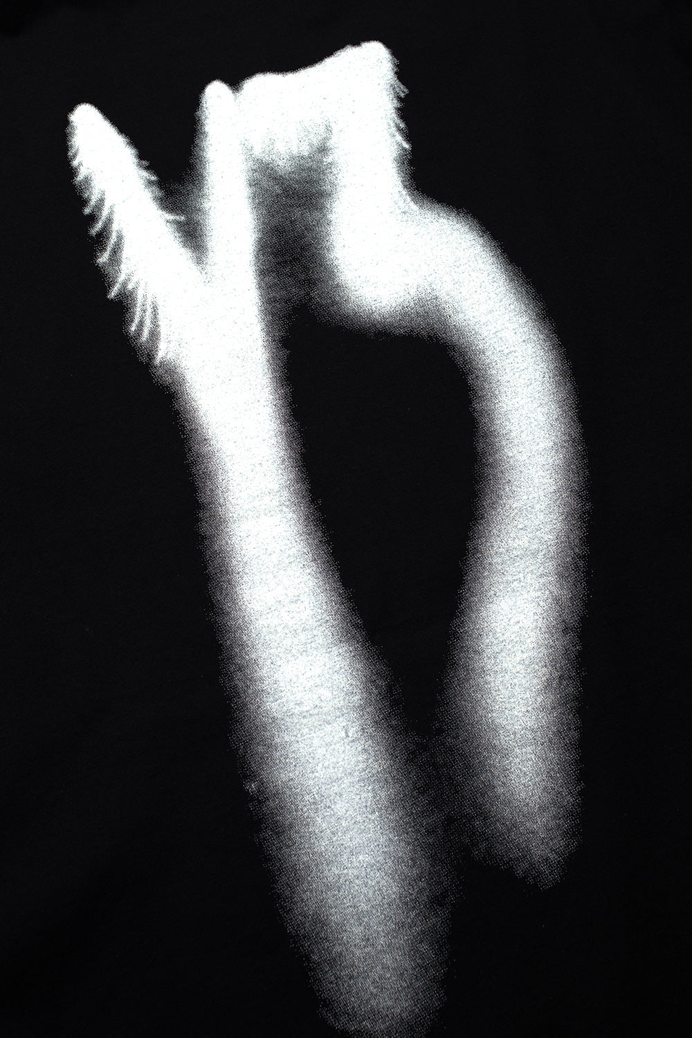 Detailed shot of the white airbrushed Y-3 logo print on the back of the black Adidas Y-3 X Chito long sleeve tee, showing the spray paint gradients and artistic feathered stroke edges.