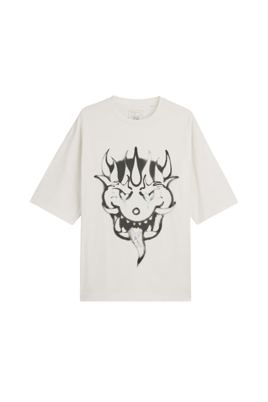Front view of the limited Adidas Y-3 x Chito GFX Graphic Short Sleeve Tee in chalk white cotton jersey, showcasing a loose boxy fit and a large black airbrushed horned monster face with silver metallic details on the chest.