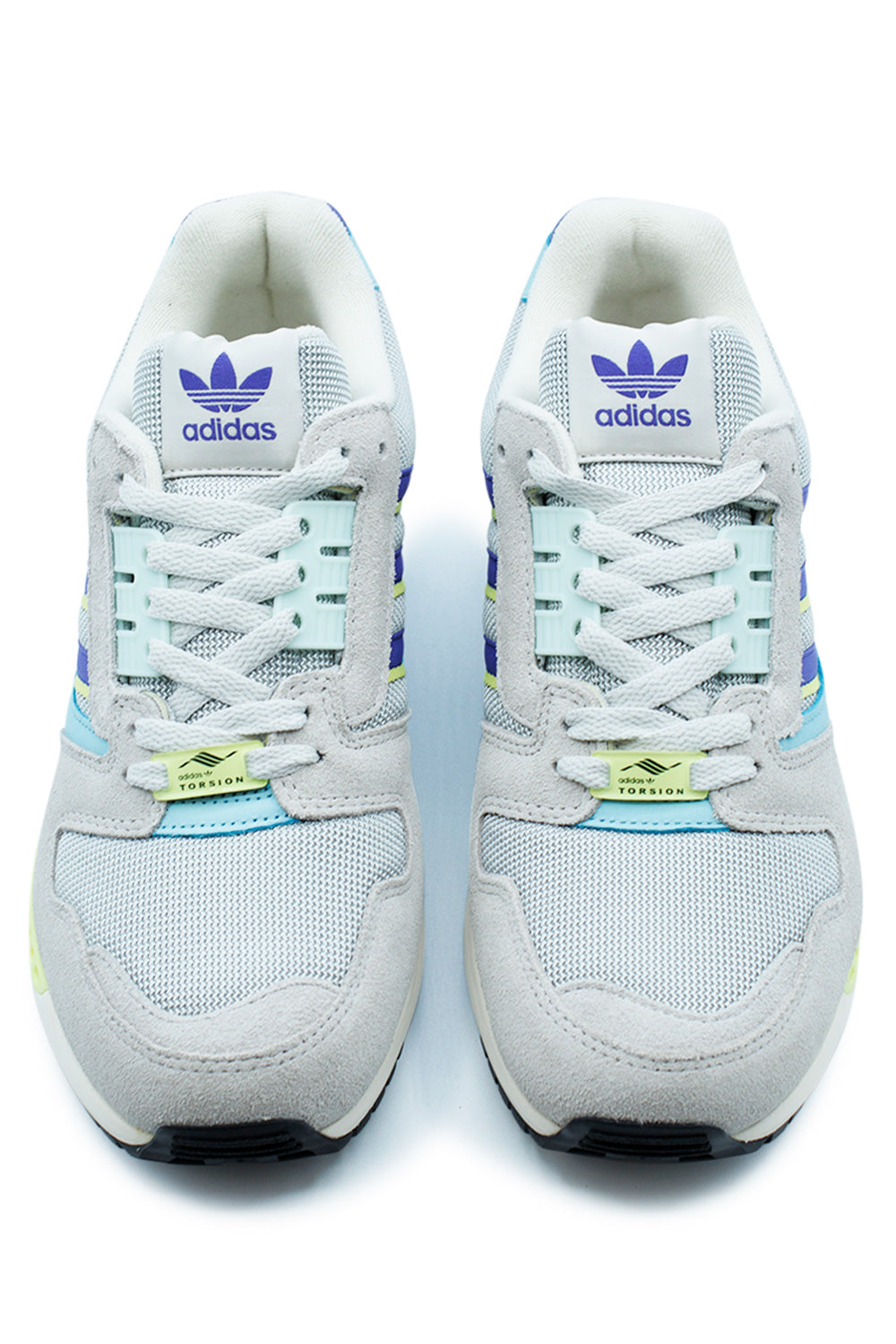 Top-down view of a pair of adidas ZX 8000 running shoes, highlighting the white laces, grey mesh toe box, and bright neon yellow Torsion lace dubraes.