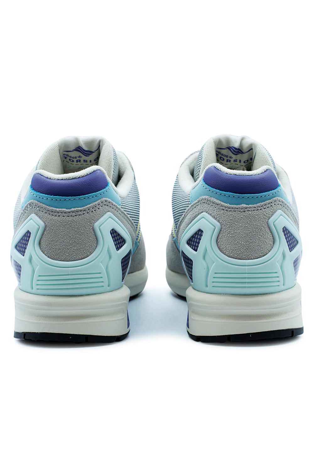 Rear heel view of the adidas ZX 8000 sneakers, detailing the light blue external plastic heel counter shell and dark purple leather trim below the collar.