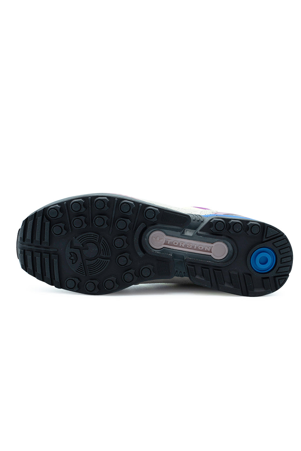 Full bottom perspective of the black rubber outsole on the Adidas ZX 8000, displaying the multi-directional round traction studs, circular blue heel strike insert pad, and the signature bone-shaped central Torsion stability bar embossed with the Adidas Trefoil logo.
