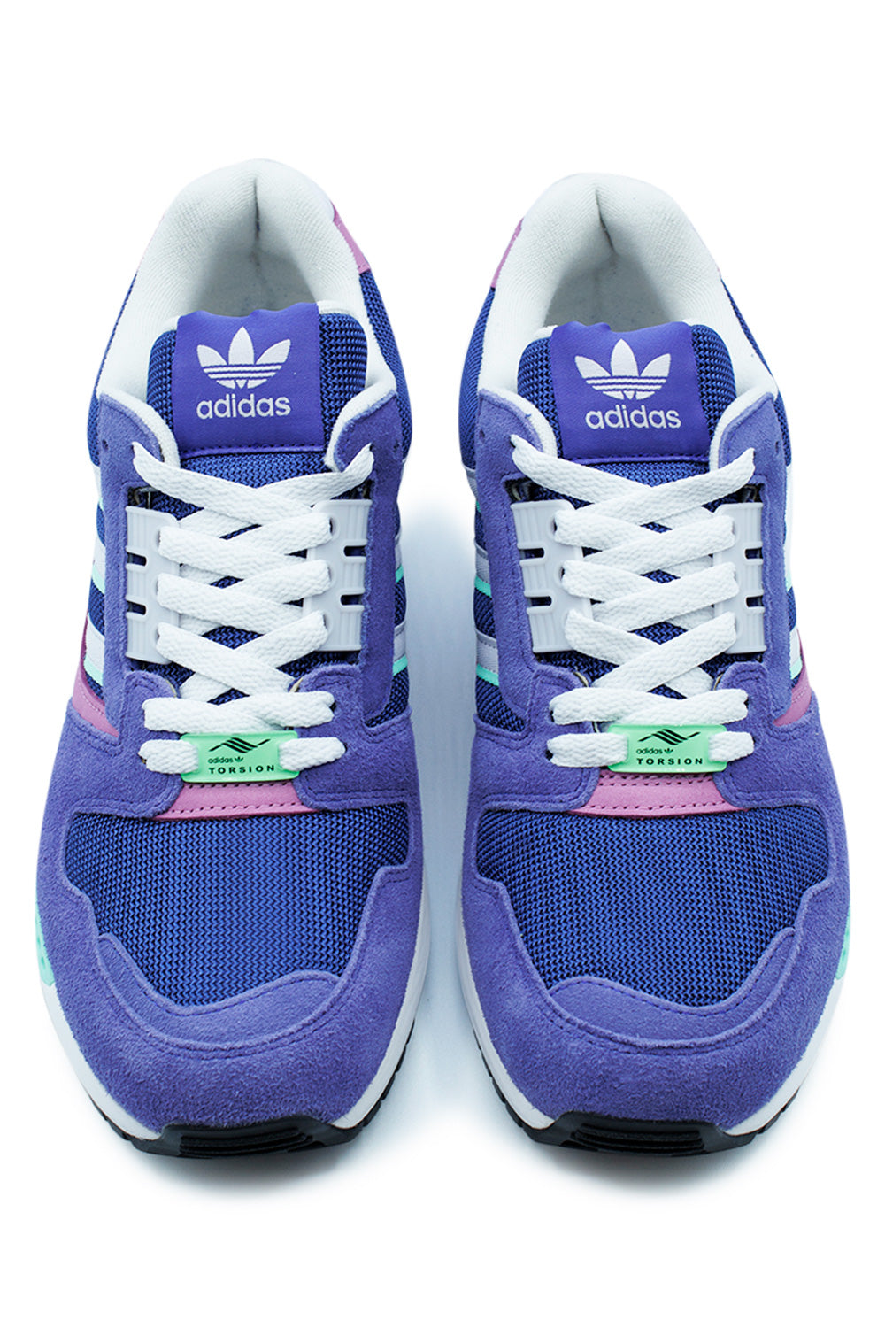 Top-down view of a pair of adidas ZX 8000 running shoes, highlighting the white laces, bright purple tongues with white branding, and light green Torsion lace dubraes.
