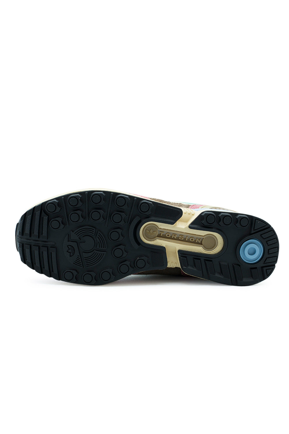 Full bottom perspective of the black rubber outsole on the Adidas ZX 8000, displaying the multi-directional round studded tread pattern, light blue circular heel impact pod, and the iconic bone-shaped Torsion bar bridge embossed with the Adidas Trefoil logo
