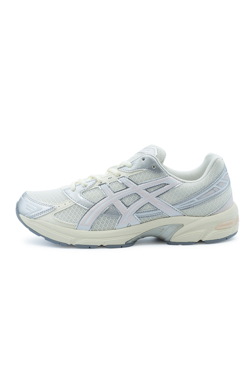 Lateral profile view of the Asics Gel-1130 running shoe in Cream and Pink Cloud, featuring a light cream open-mesh base, iridescent metallic silver synthetic overlays, pale Pink Cloud tiger stripes, an off-white foam midsole with exposed rearfoot GEL cushioning, and a light grey rubber outsole.