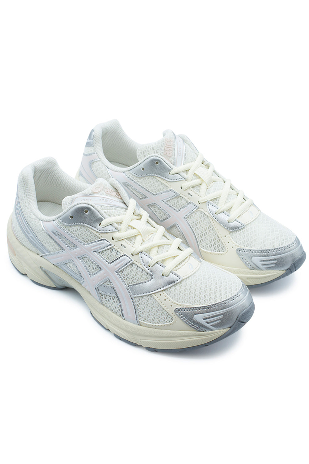 Elevated three-quarter studio perspective of the Asics Gel-1130 in Cream / Pink Cloud, highlighting the late-2000s archival running silhouette, dynamic metallic overlays inspired by the Gel-Kayano 14, and layered mesh construction.