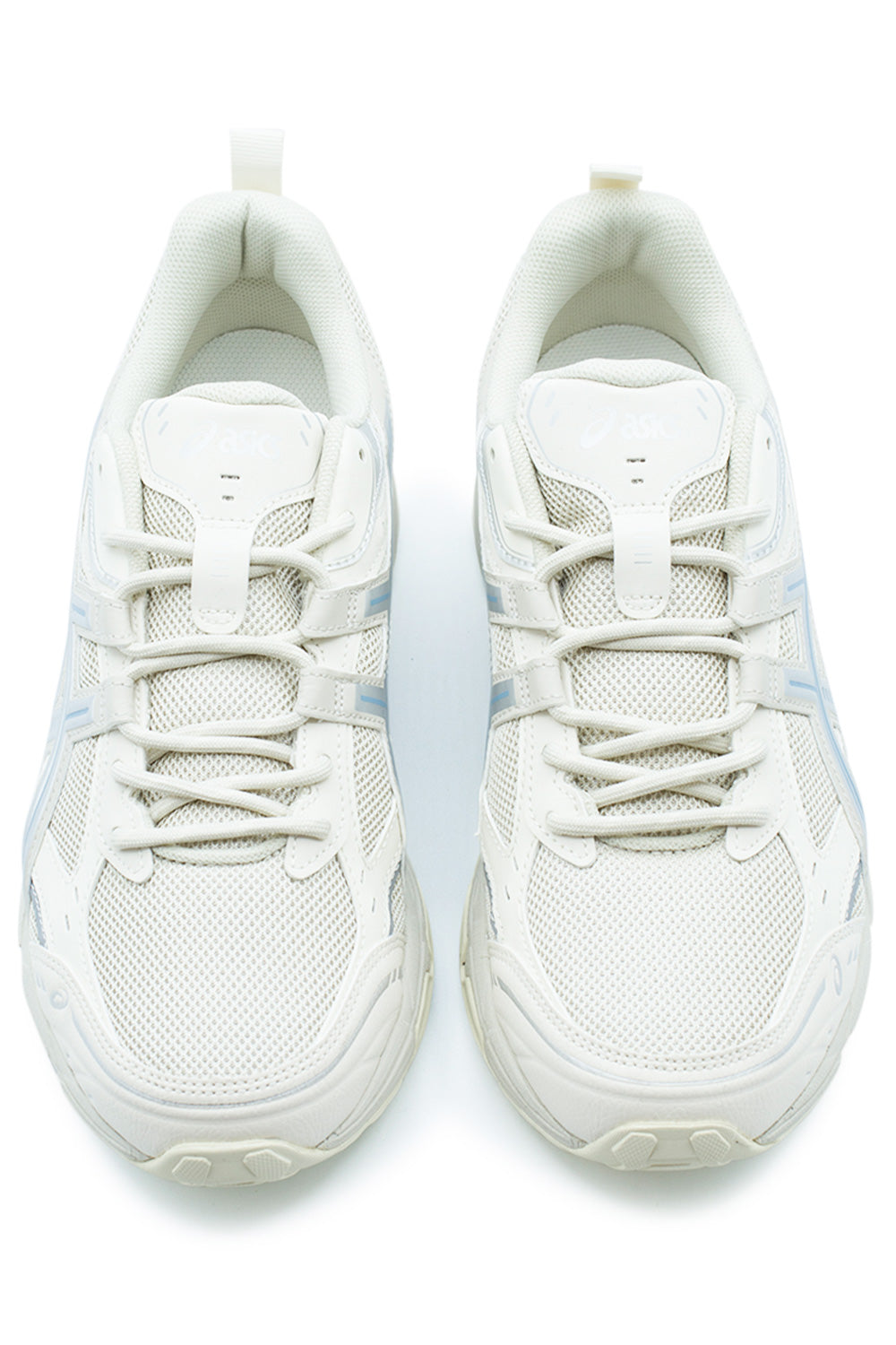 Top-down studio shot of the Asics Gel-Nunobiki shoes, displaying the breathable cream mesh forefoot, reinforced off-white synthetic toe bumpers, round cream hiking-style laces, and padded mesh tongue with an embossed tonal Asics emblem.