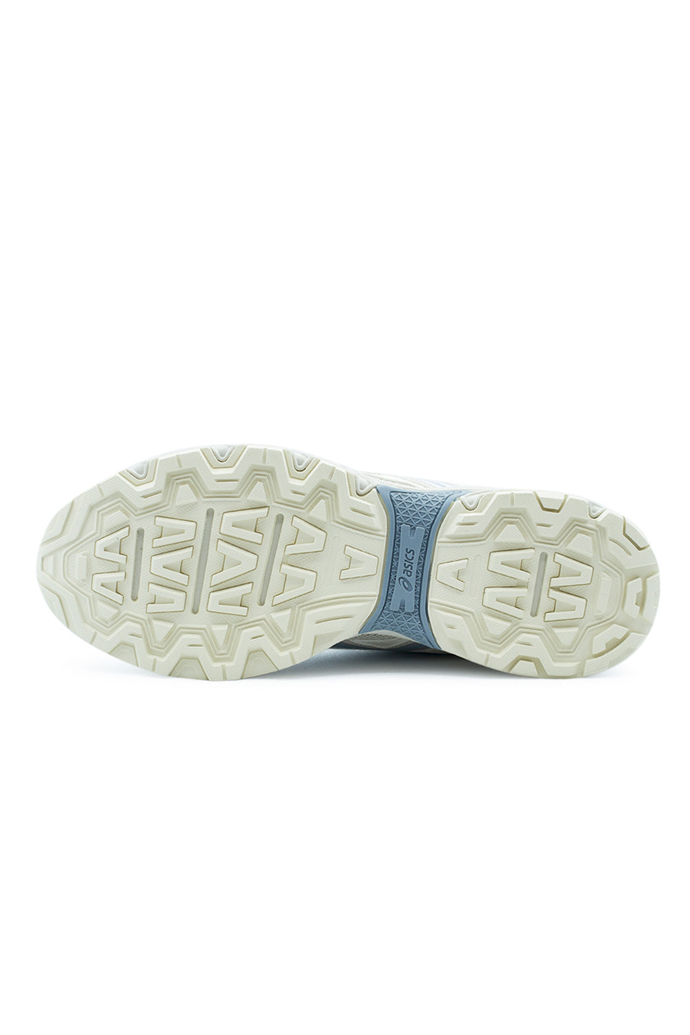 Full bottom view of the light cream rubber outsole on the Asics Gel-Nunobiki, showing the aggressive chevron and geometric trail traction lugs alongside the contrasting textured slate blue midfoot stability bridge with Asics branding.
