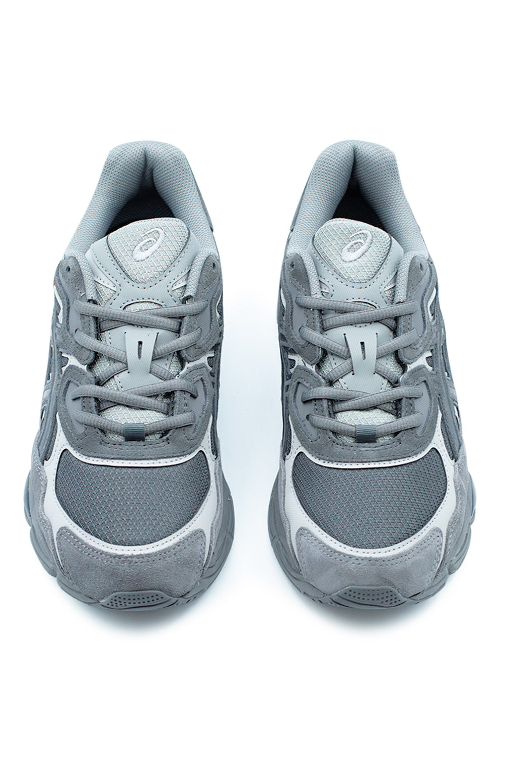 Front angle of ASICS GEL-NYC Obsidian Grey running-inspired sneaker with structured mesh upper, reinforced toe overlays, and classic early-2000s performance design aesthetic