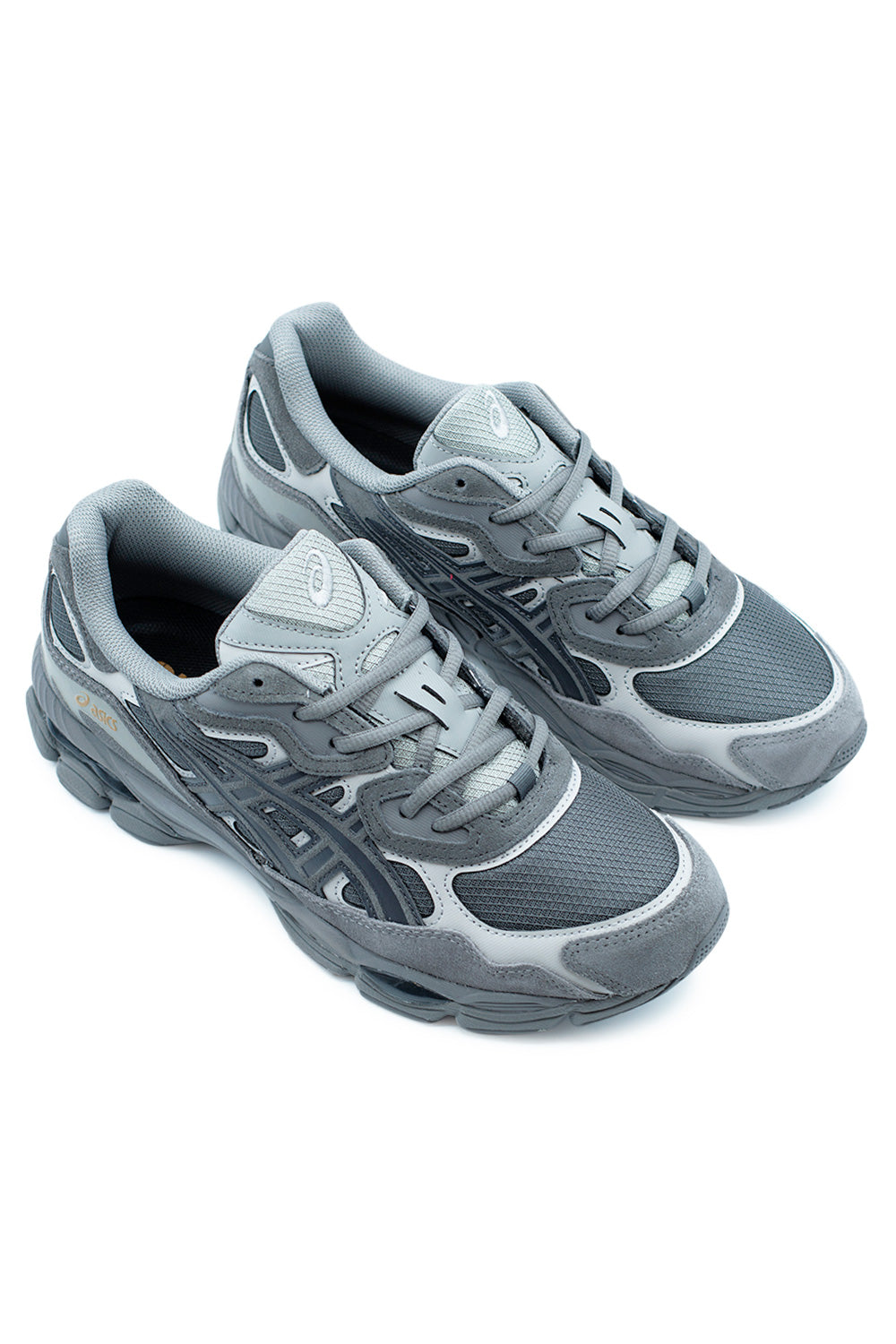 Pair of ASICS GEL-NYC Obsidian Grey sneakers displaying technical panel construction, breathable mesh underlays, and durable suede layers for everyday streetwear comfort and stability