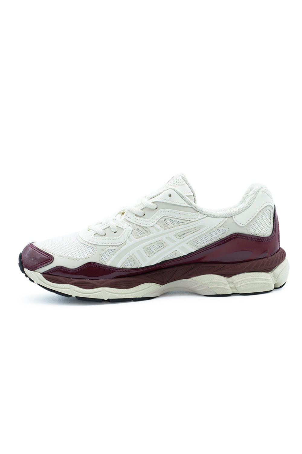 Medial arch profile view of the Asics Gel-NYC sneaker, detailing the inner cream synthetic leather cage, contoured antique red patent leather mudguard rand, sculpted Flytefoam arch bridge, and multi-segmented rubber outsole